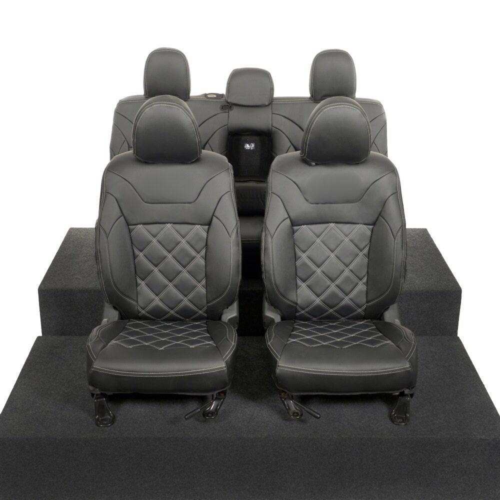 Mitsubishi L200 2015-2021 tailored leatherette seat covers in white double diamond Bentley stitch, showcasing premium fit with headrest and armrest covers.