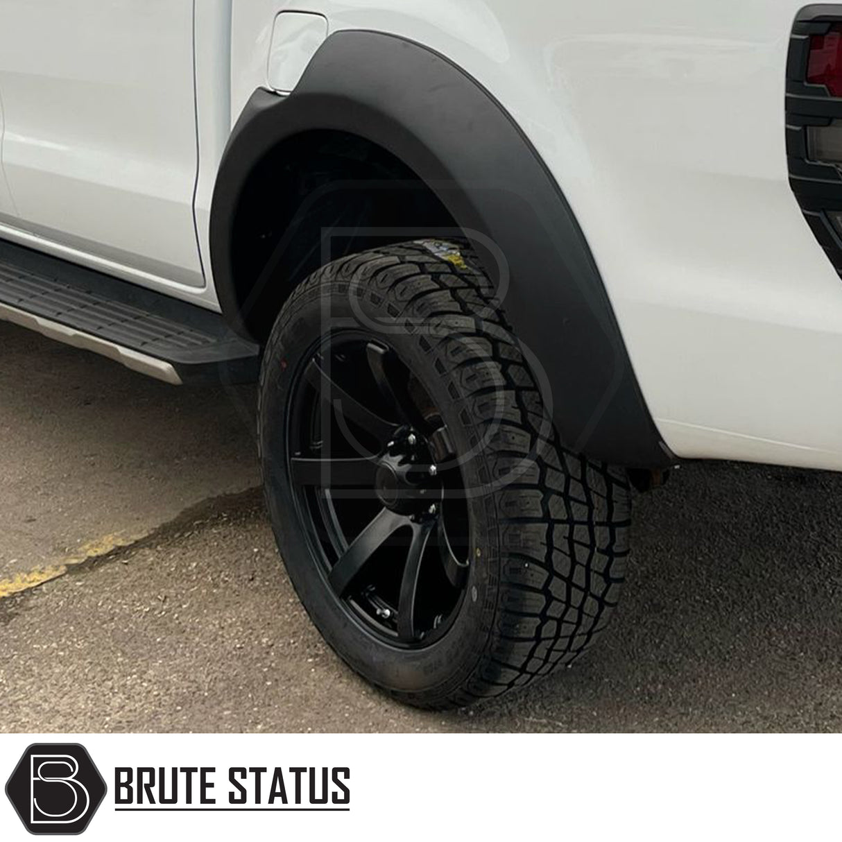 AXE Wheels Quake in Matt Black, showcasing a close-up of the alloy wheel rim with a distinctive red logo, highlighting its design and craftsmanship.