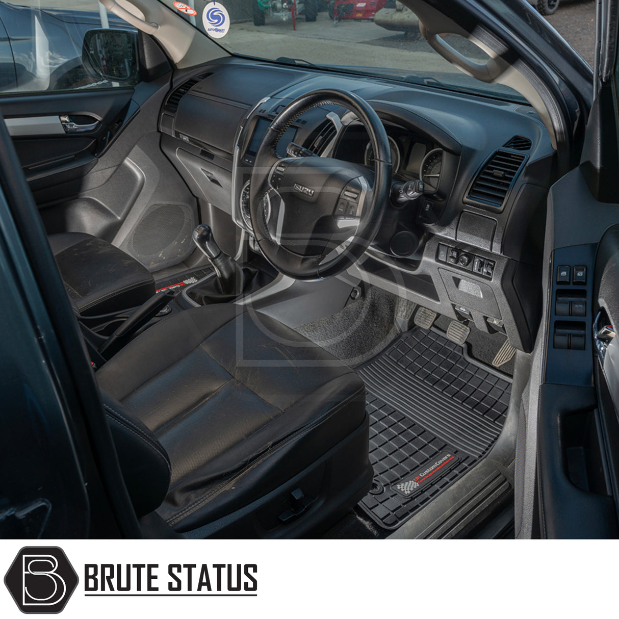 Isuzu D-Max 2012-2020 Double Cab Rubber Floor Mats, tailored for right-hand drive vehicles, visible inside a car, offering heavy-duty, waterproof protection.