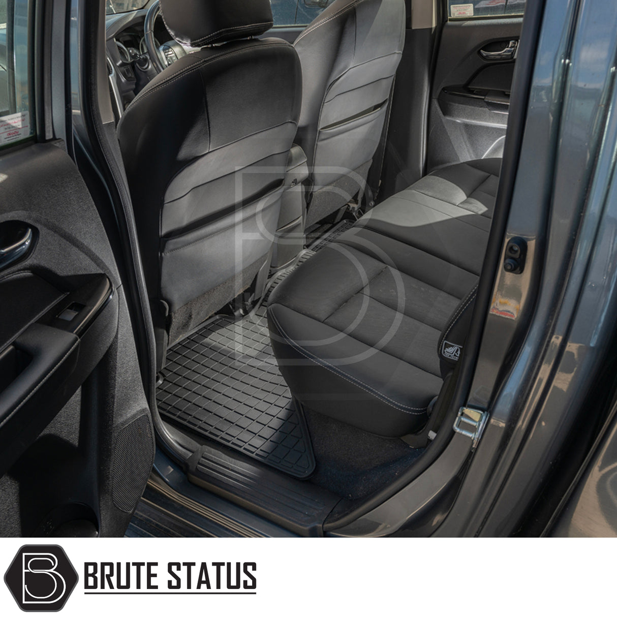 Isuzu D-Max 2012-2020 Double Cab Rubber Floor Mats shown in the back seat of a car, highlighting custom fit and durability.