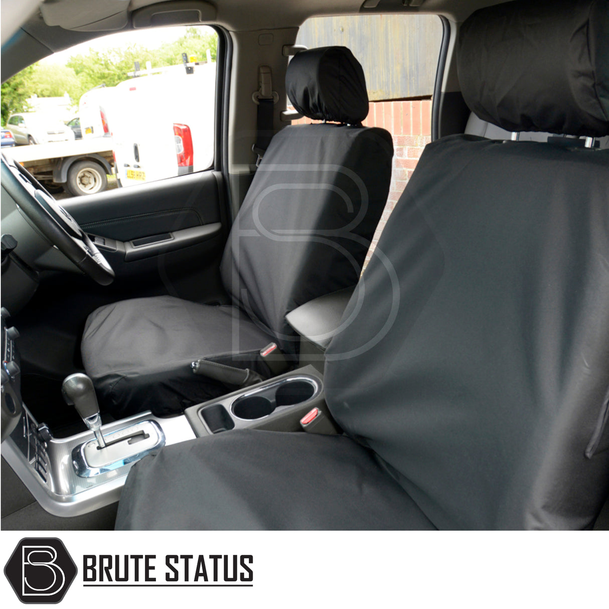 Nissan Navara 2005-2015 D40 Double Cab seat covers, black, tailored fit, visible in front-seat interior, featuring premium cotton-backed polyester by Brute Status.