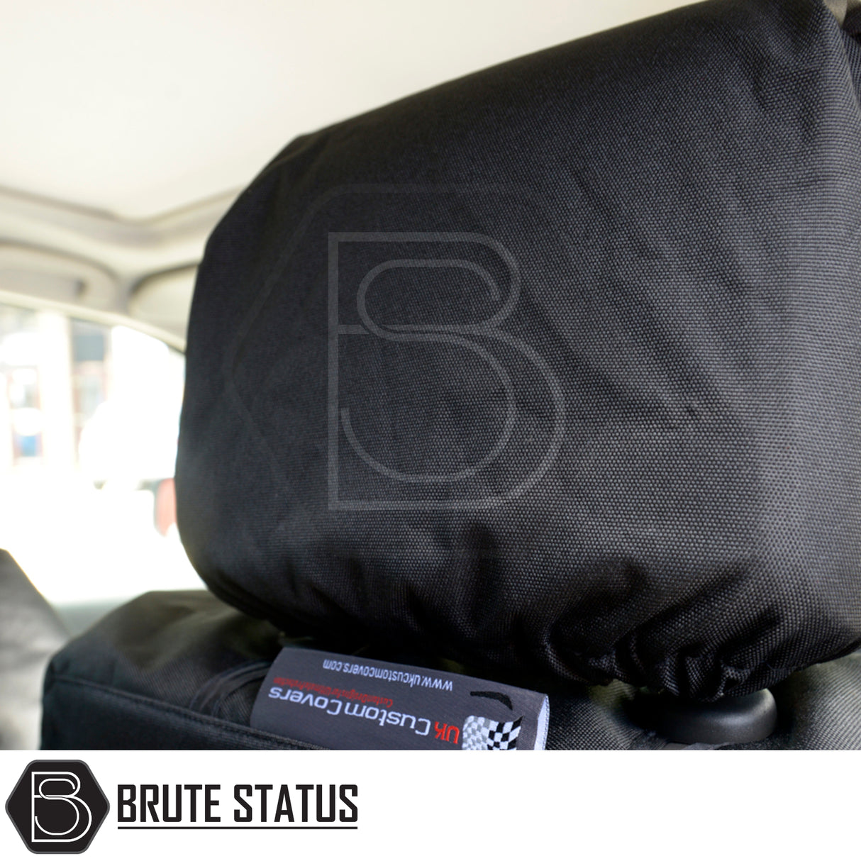 Nissan Navara 2005-2015 D40 headrest cover in durable black fabric with UK Custom Covers tag, showcasing Brute Status's aftermarket accessory quality.
