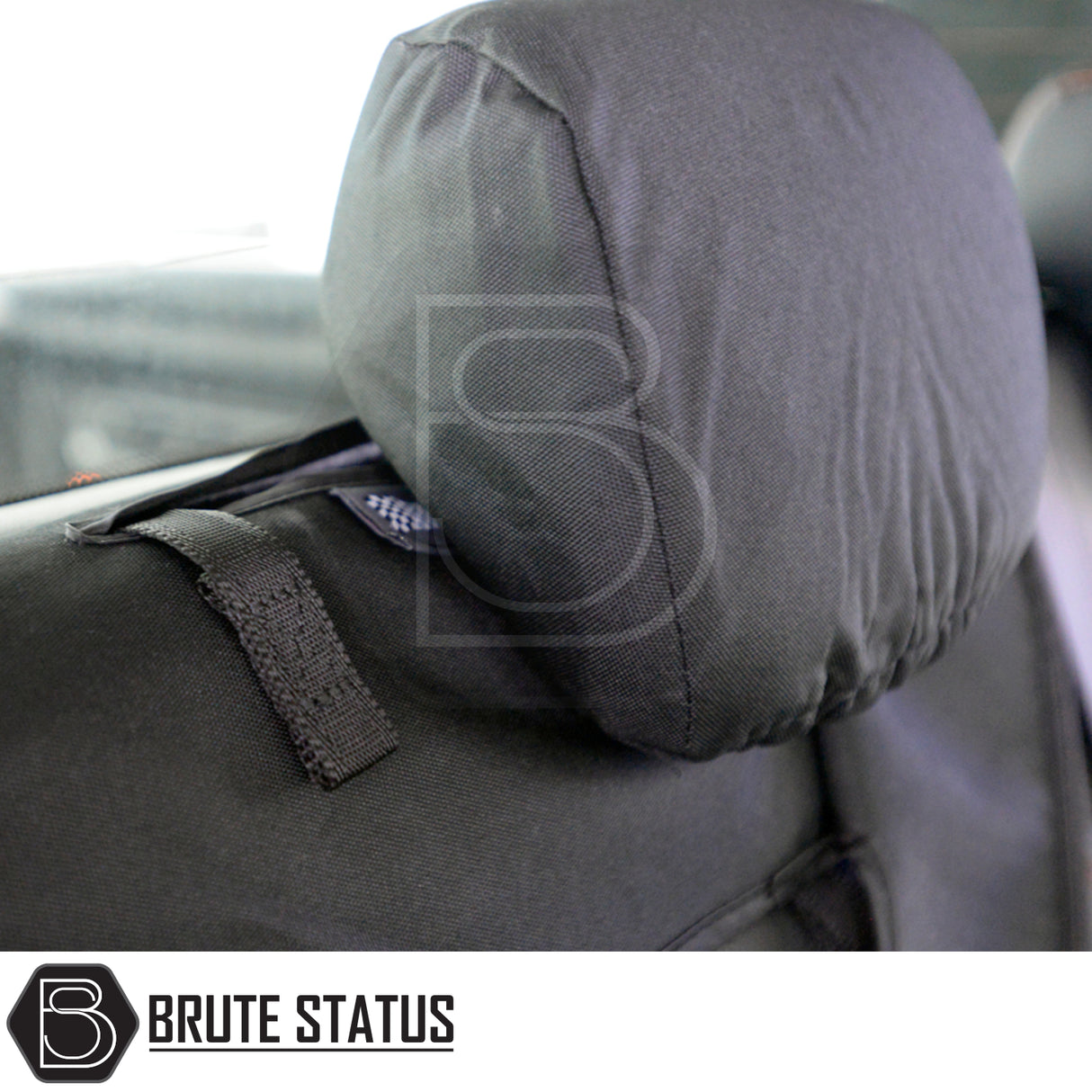 Ford Ranger 2012-2022 seat cover on headrest with Brute Status logo, tailored fit, waterproof, durable cotton-backed polyester for enhanced protection and style.