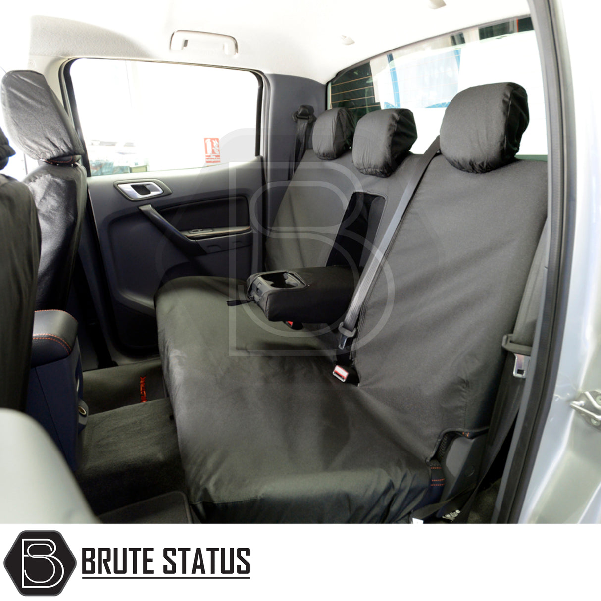 Ford Ranger 2012-2022 seat covers by Brute Status, tailored black covers with integrated armrest, durable cotton-backed polyester, fitting pickup's interior seamlessly.