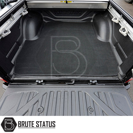 Nissan Navara 2015-2023 NP300 Carpet Load Bed Liner in vehicle trunk, showcasing durable carpet with non-slip backing, tailored fit for secure cargo storage.