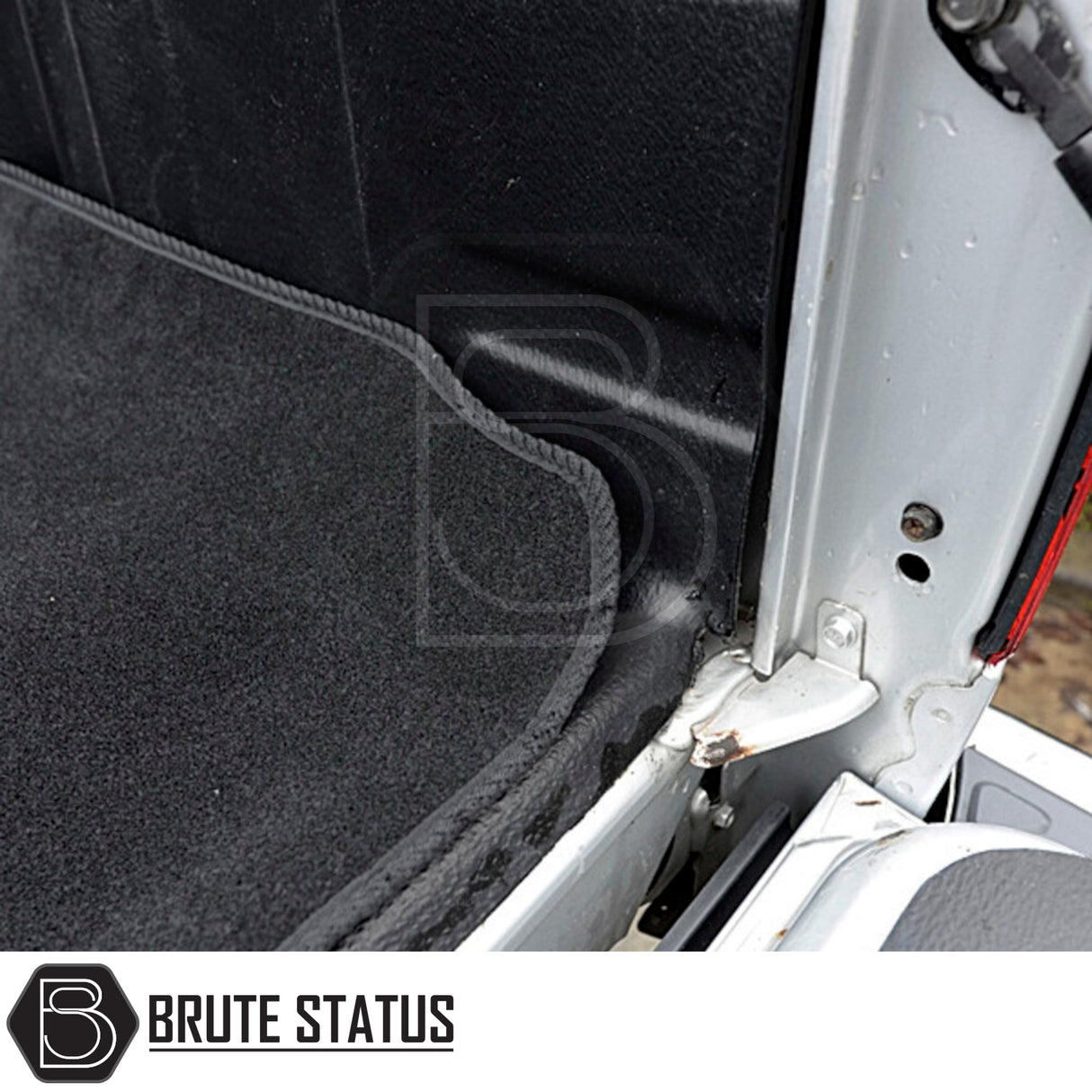Nissan Navara 2005-2015 D40 Carpet Load Bed Liner in vehicle, showcasing tailored fit and durable non-slip carpet for secure cargo placement.