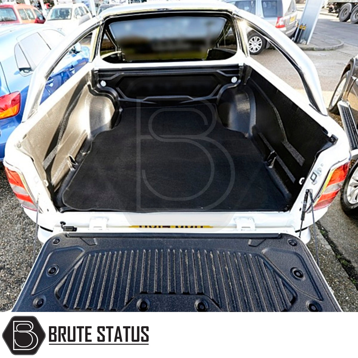 Mitsubishi L200 2010-2021 Carpet Load Bed Liner shown in a car trunk, highlighting its custom fit and durable, non-slip carpet material.