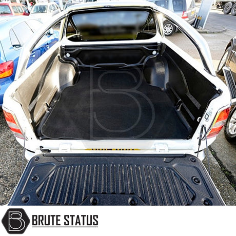 Mitsubishi L200 2010-2021 Carpet Load Bed Liner shown in a car trunk, highlighting its custom fit and durable, non-slip carpet material.