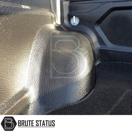 Mitsubishi L200 2010-2021 carpet load bed liner, tailored fit for Series 4-6, shown inside truck bed, offers non-slip durability for secure cargo placement.