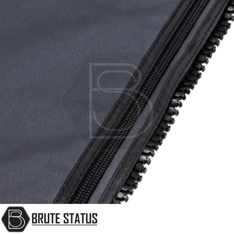 Close-up of a heavy-duty black zipper on the ARB Altitude Side Awning Kit, featuring the BRUTE STATUS logo on dark fabric.