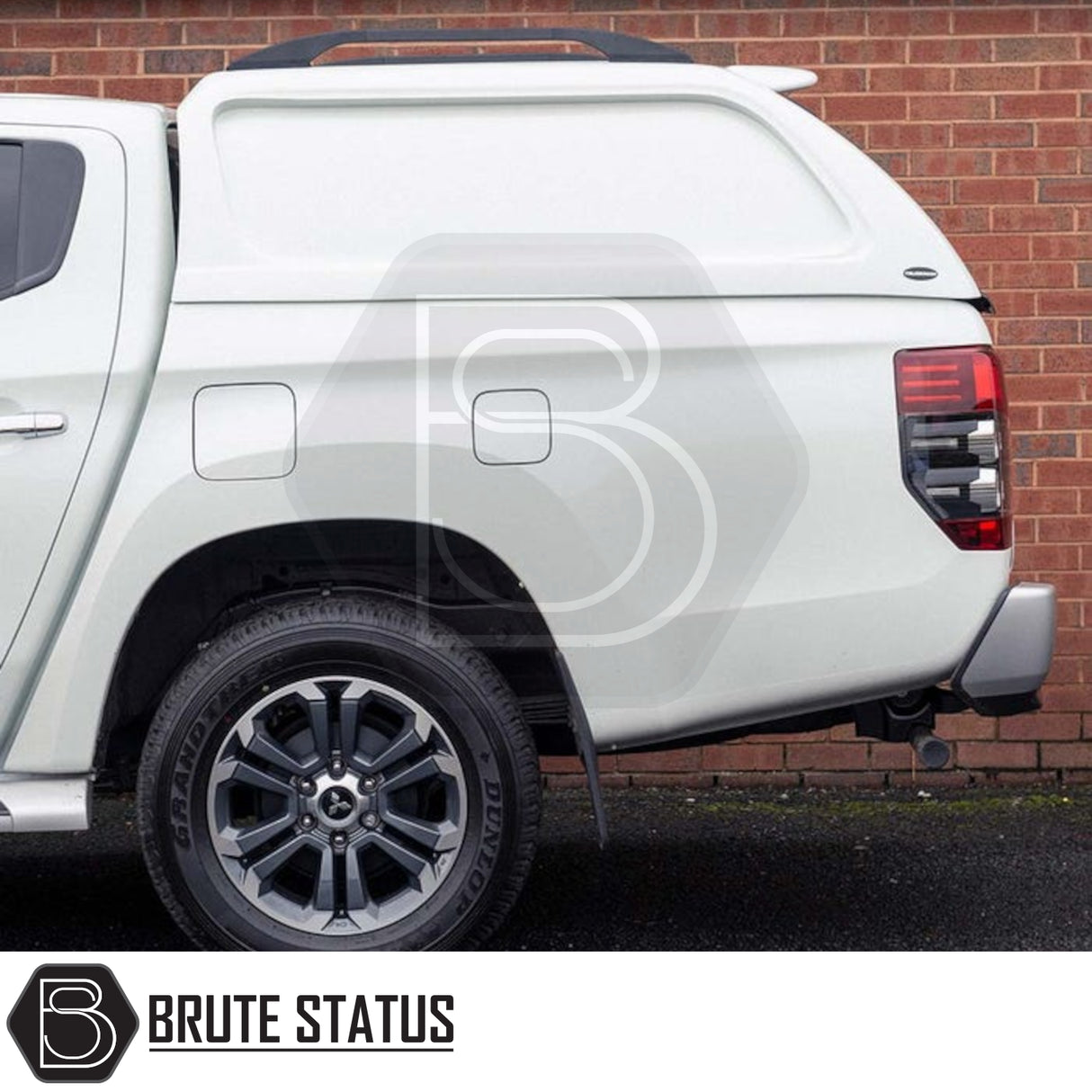 Fiat Fullback/Mitsubishi L200 Truckman L-Series Canopy: solid-sided, remote locking hardtop enhancing security and storage, seen fitted on a white pickup truck.