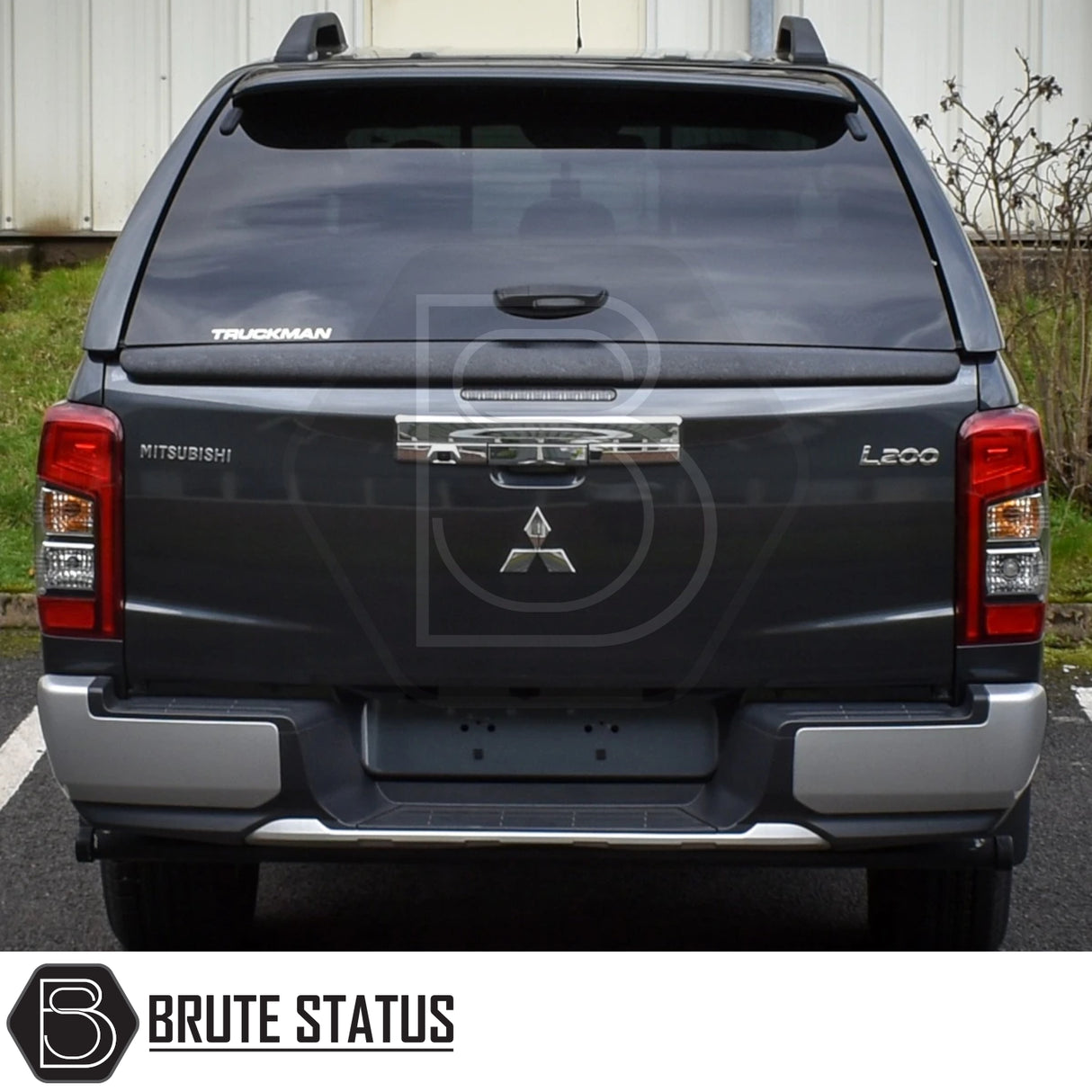 Rear view of Mitsubishi L200 with Truckman GLS Hardtop Canopy, showcasing lockable sliding windows and Mitsubishi badge. Ideal for secure, stylish truck storage.