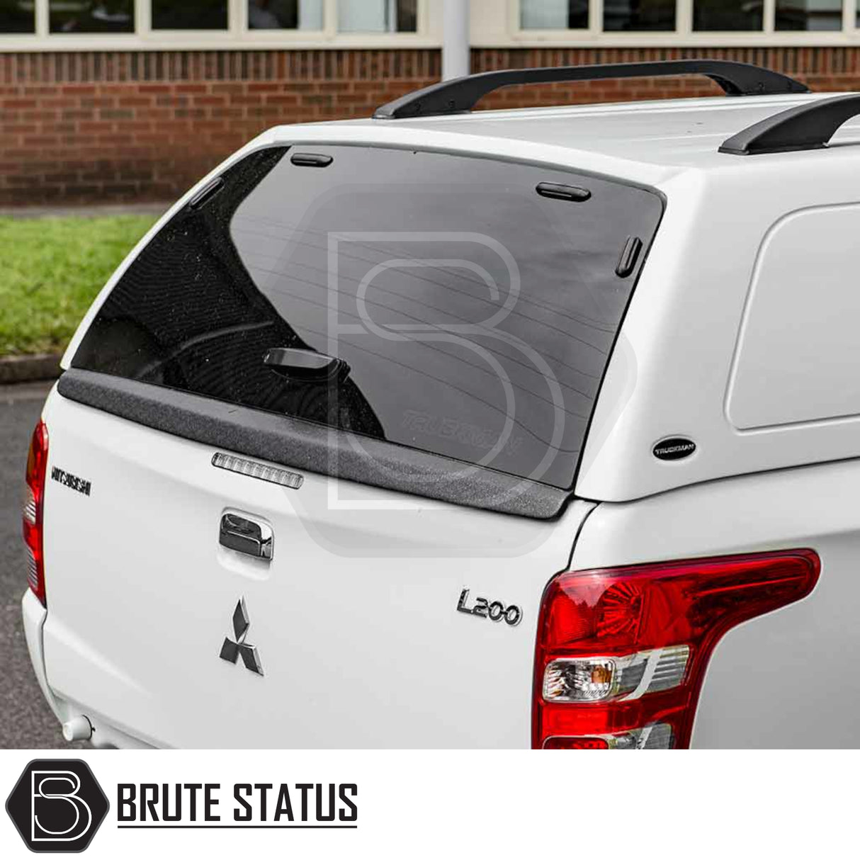 Fiat Fullback/Mitsubishi L200 Truckman RS canopy with tinted rear window, roof rails, and L200 badge, showcasing a robust, secure design for commercial use.
