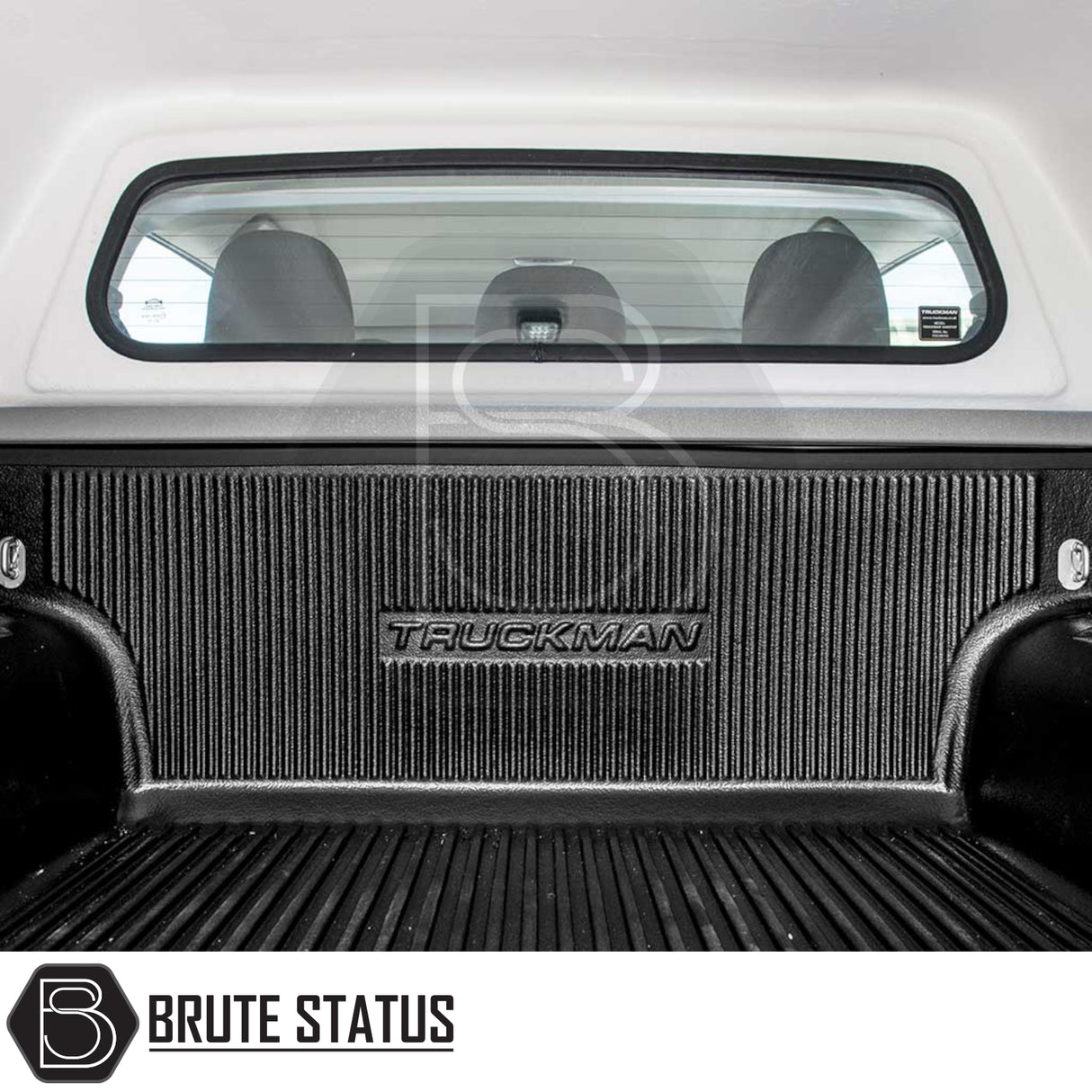 Pickup truck bed with black Truckman-branded liner, showcasing Fiat Fullback/Mitsubishi L200 Truckman RS Hardtop Canopy with glazed rear window and remote locking.