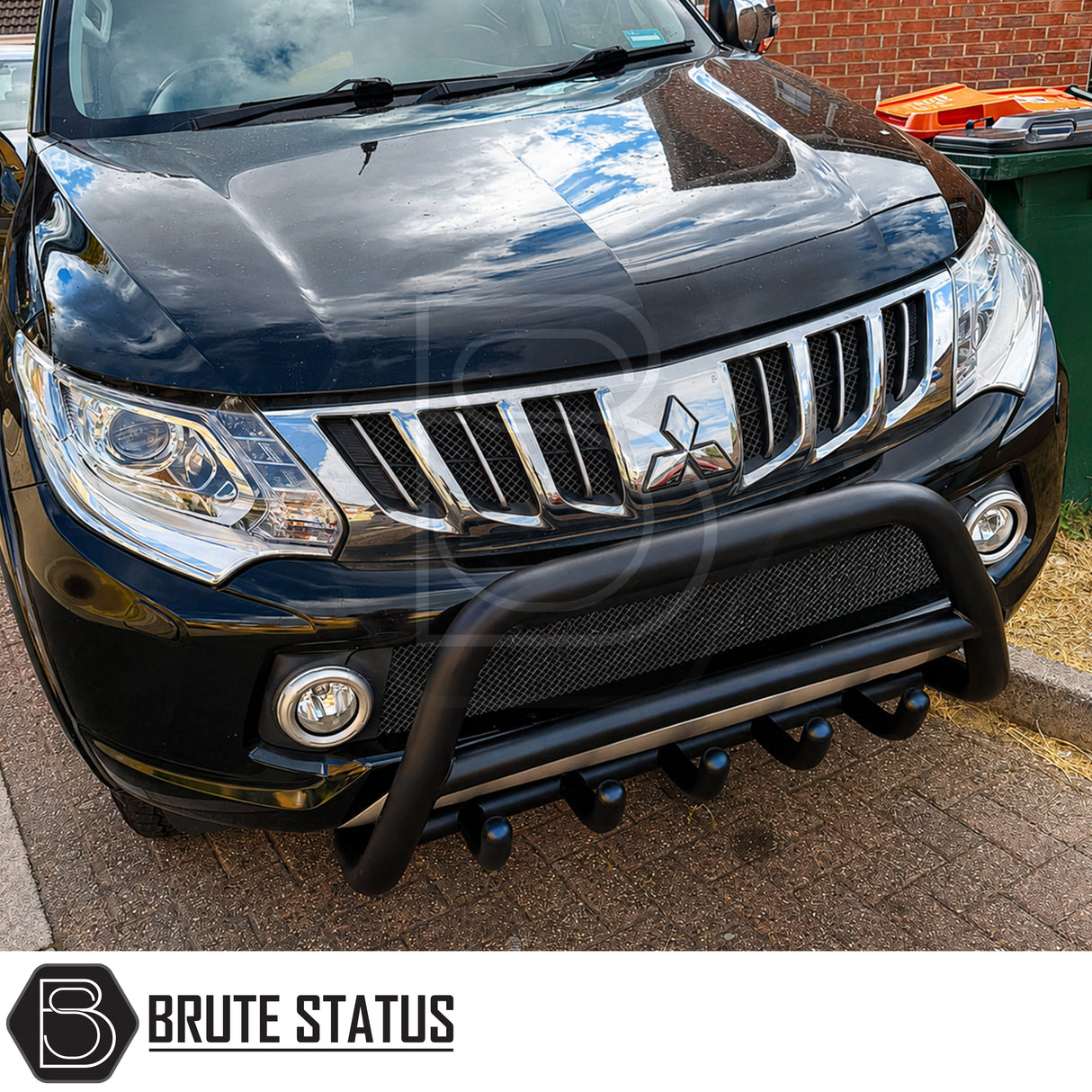 Front heavy duty carbon steel bull bar defence fitted to Black Mitsubishi L200 Series 5 suitable for overlanding set ups, all mounting hardware included.