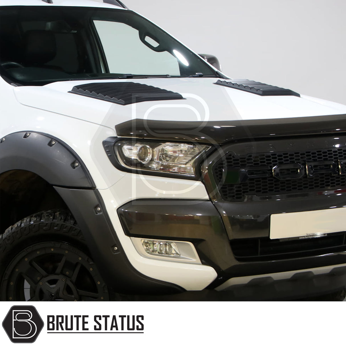 Black bonnet vent scoop fitted to Ford Ranger 2012–2022 model, featuring smooth gloss finish and aggressive styling with secure 3M adhesive installation.