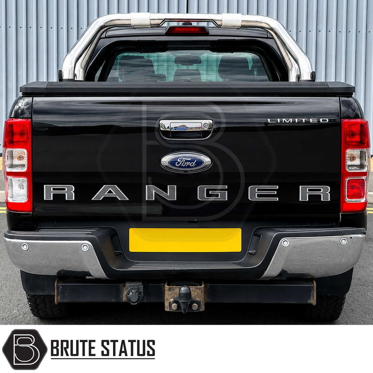 Rear chrome silver metal bumper fitted to black Ford Ranger pickup truck offroad 4x4 vehicle. Suitable for overlanding set ups and compatible with rear parking sensors.