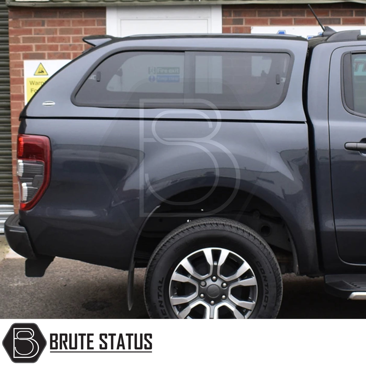 Ford Ranger 2012-2022 T6, T7, T8 Truckman GLS Hardtop Canopy with remote locking and roof bars, shown from rear ¾-side, featuring tinted canopy window and alloy wheel.