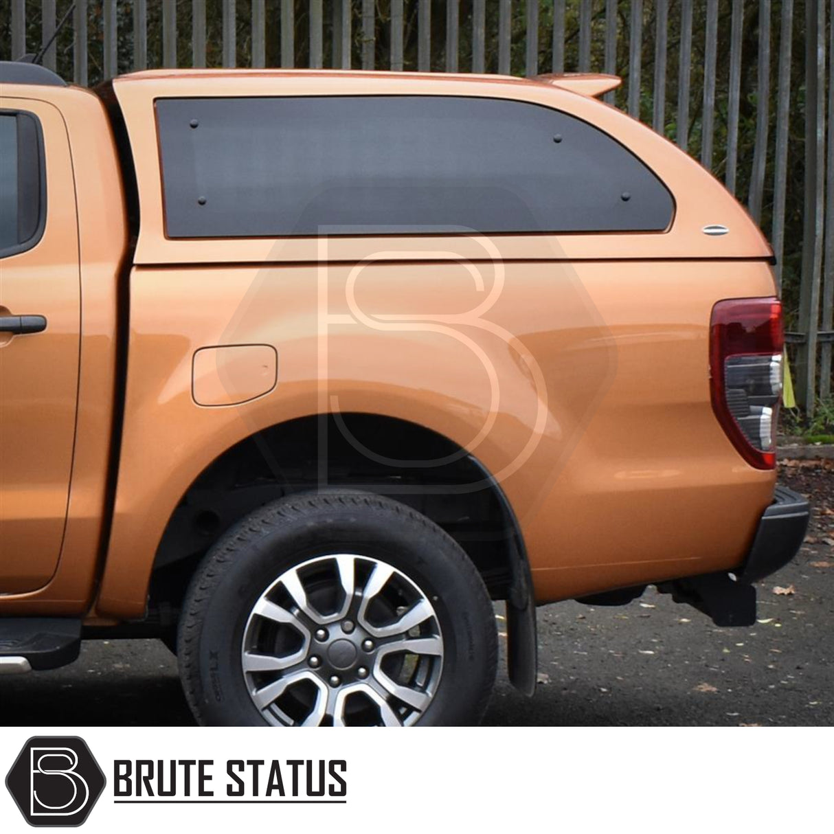 Ford Ranger 2012-2022 Truckman Grand Hardtop Canopy with remote locking, tinted windows, and alloy wheel visible, enhancing pickup style and functionality.