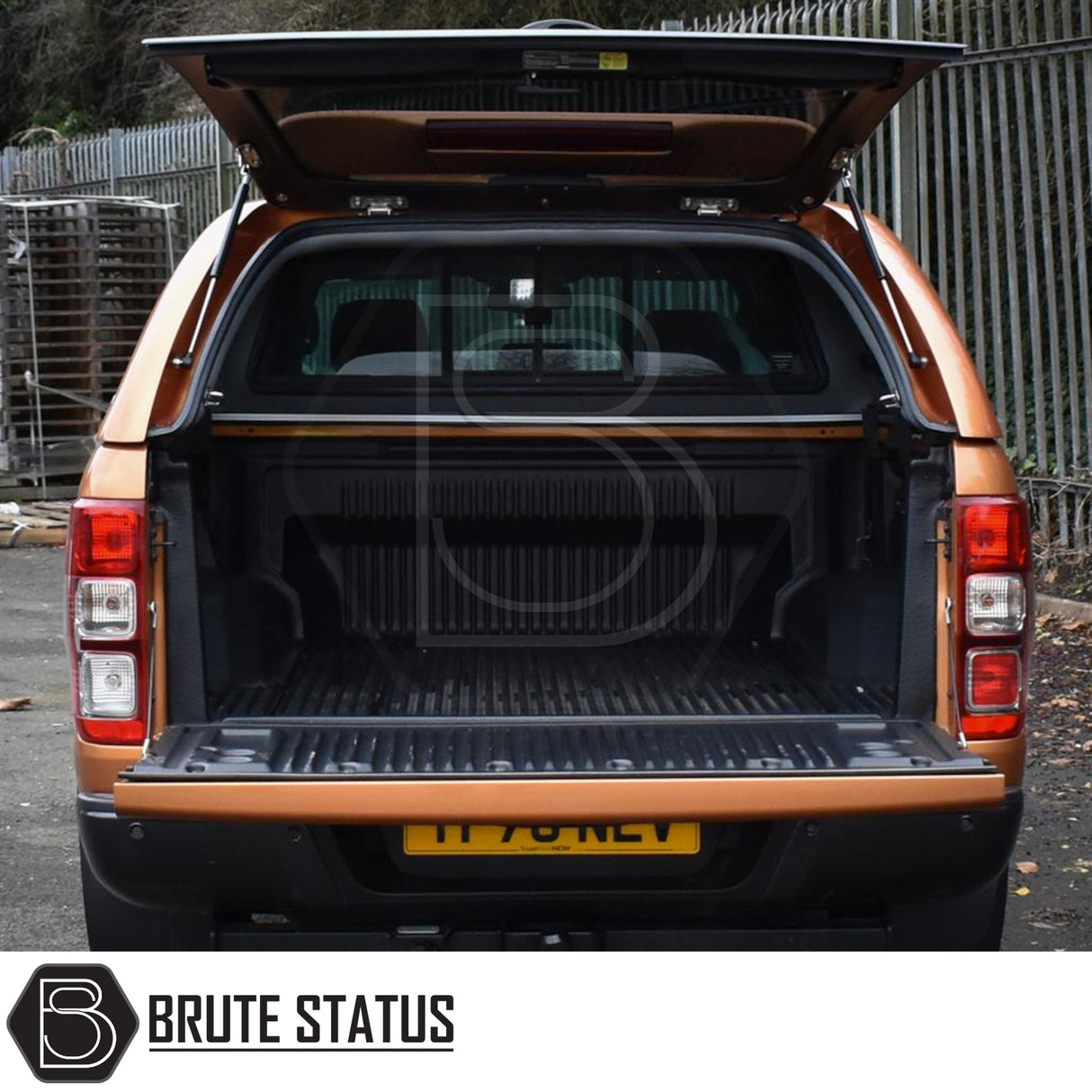 Ford Ranger 2012-2022 Truckman Grand Hardtop Canopy - Remote Locking shown open, highlighting empty ribbed truck bed. Canopy enhances storage with stylish, secure features.