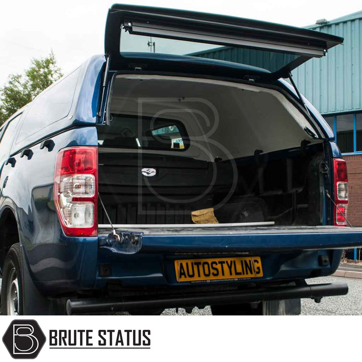 Ford Ranger 2012-2022 Truckman RS Hardtop Canopy on a blue pickup, showcasing an open solid rear window and empty load bay, emphasizing security and versatility.