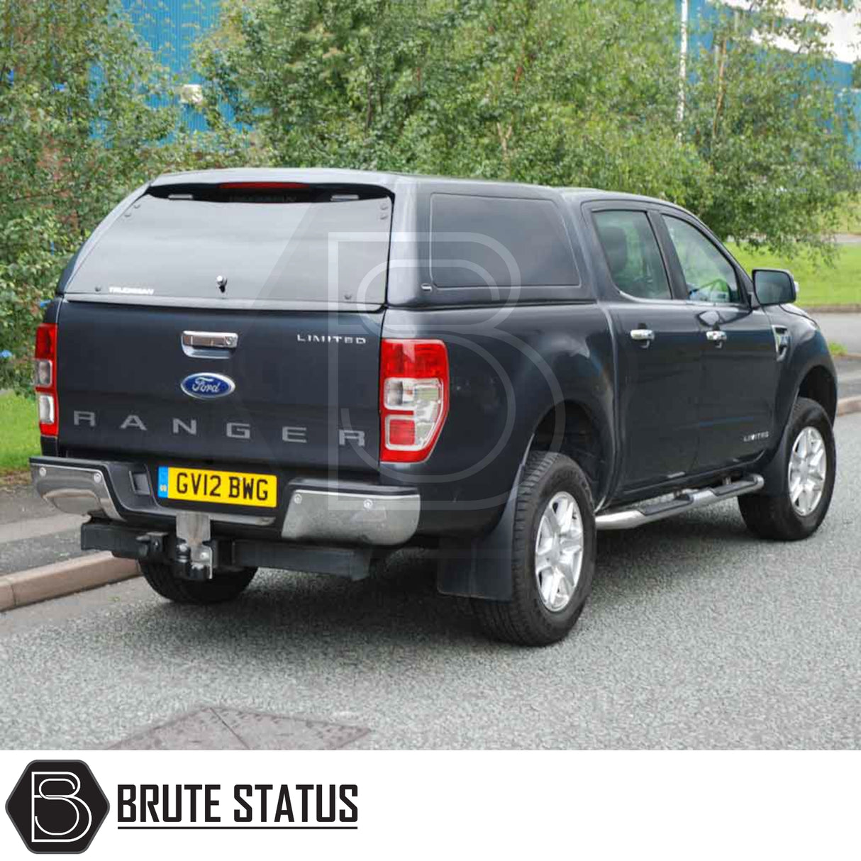 Rear view of a black Ford Ranger fitted with a Truckman RS Hardtop Canopy featuring a solid rear window and tow hitch.