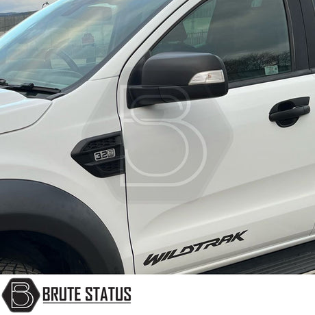 Pair of matte black ABS plastic door mirror covers for 2012–2022 Ford Ranger models with indicator mirrors, featuring pre-applied 3M adhesive for easy, tool-free installation