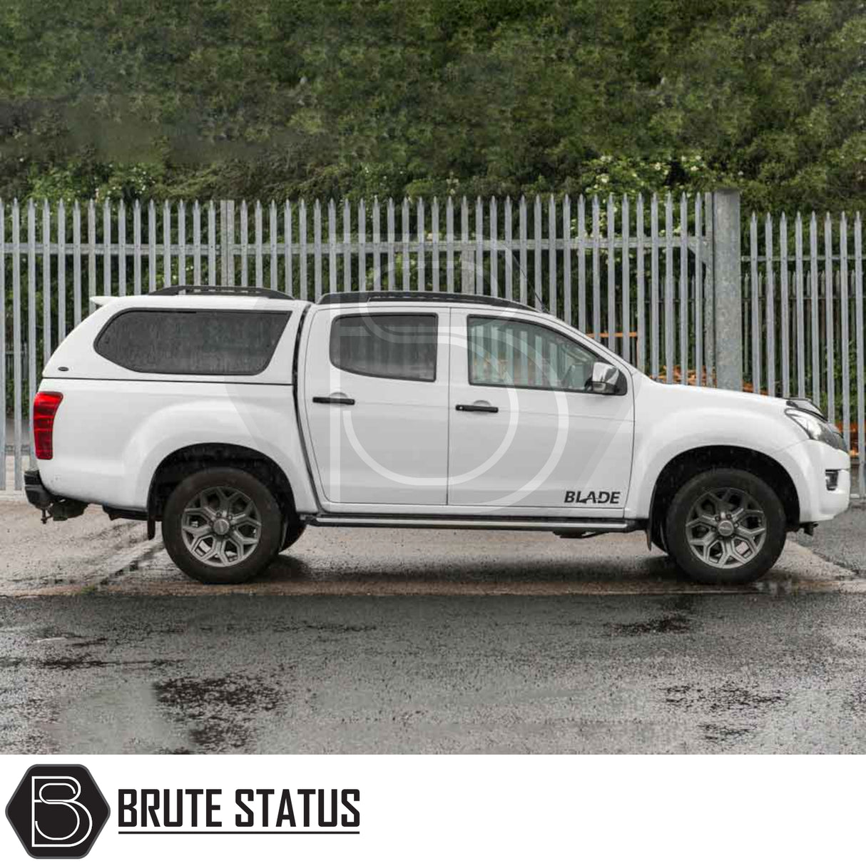 Isuzu D-Max 2012-2021 Truckman GLS Hardtop Canopy with remote locking and roof bars on a white pickup, showcasing Brute Status's aftermarket design.