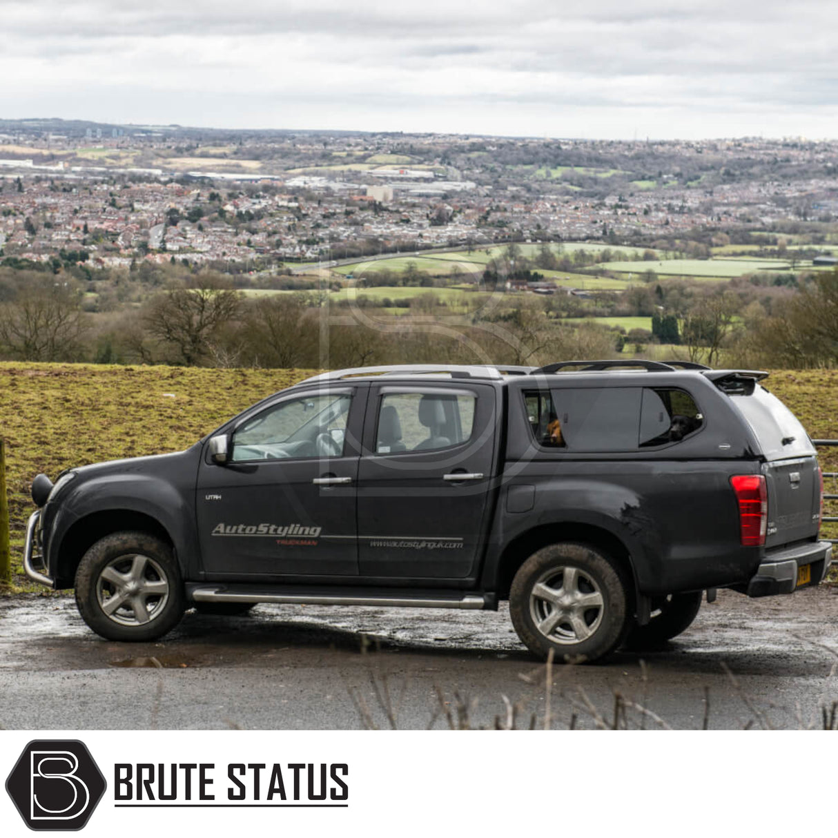 Isuzu D-Max 2012-2021 Truckman GLS Hardtop Canopy with remote locking and roof bars on a pickup, embodying ruggedness and luxury amidst a scenic landscape.