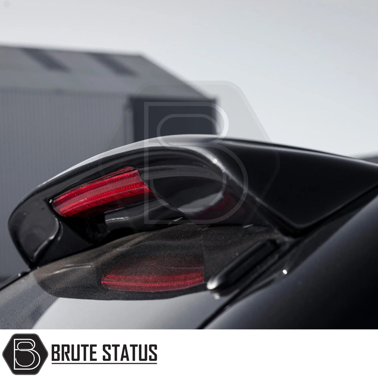 Close-up of a black sports car’s rear spoiler with glowing red LED light, showcasing the Isuzu D-Max 2012-2021 Truckman Grand Hardtop Canopy - Remote Locking.