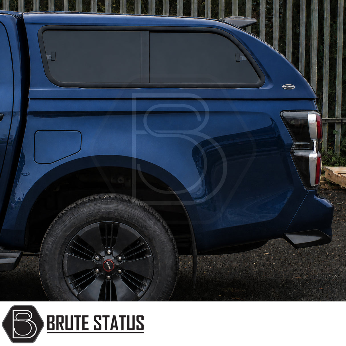 Truckman GLS canopy fitted to Isuzu D-Max pickup truck with roof bars and heated rear window