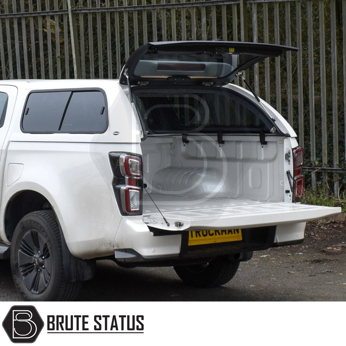 Isuzu D-Max 2021-2024 Truckman GLS Hardtop Canopy with remote locking, roof bars, and open rear, showcasing its spacious, secure cargo bed.