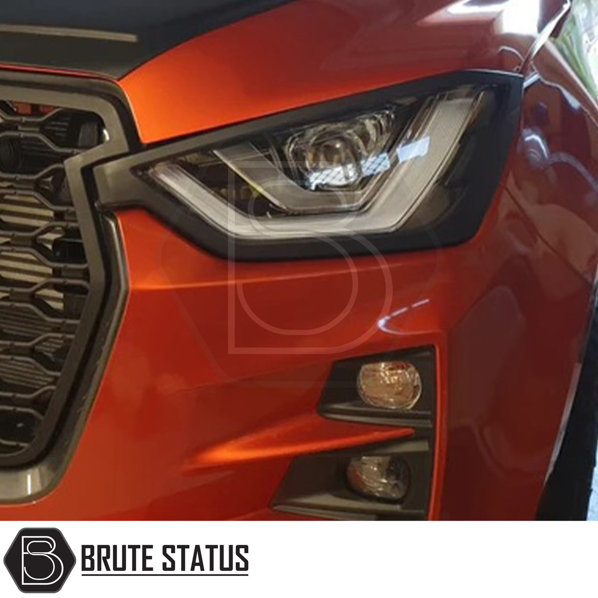 Isuzu D-Max 2021+ Headlight Covers in matt black, showcasing a sleek design for enhanced front-end aesthetics, perfect for a distinctive truck upgrade.