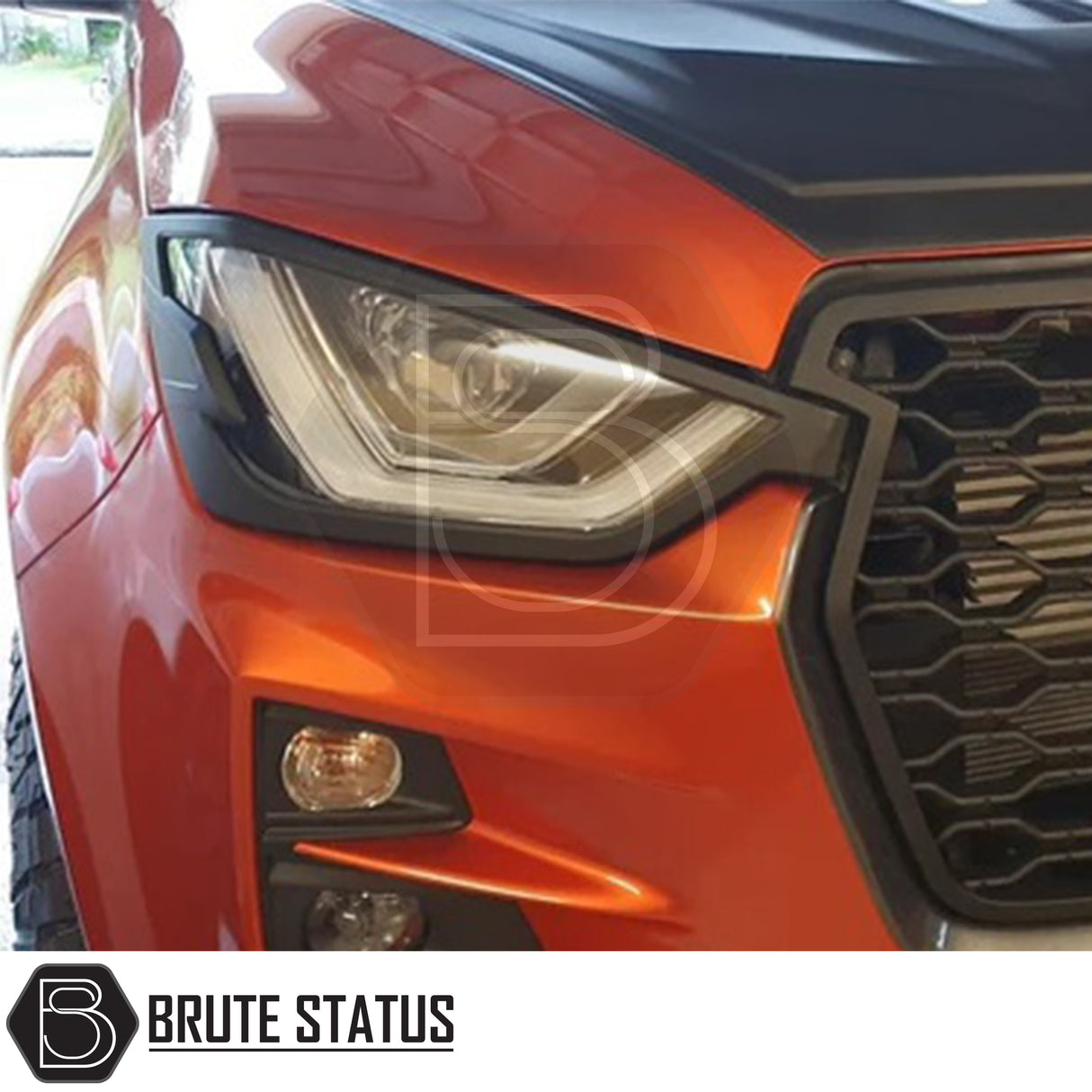 Isuzu D-Max 2021+ Headlight Covers in matt black, showcasing a sleek design for enhanced front-end aesthetics, perfect for a distinctive truck upgrade.