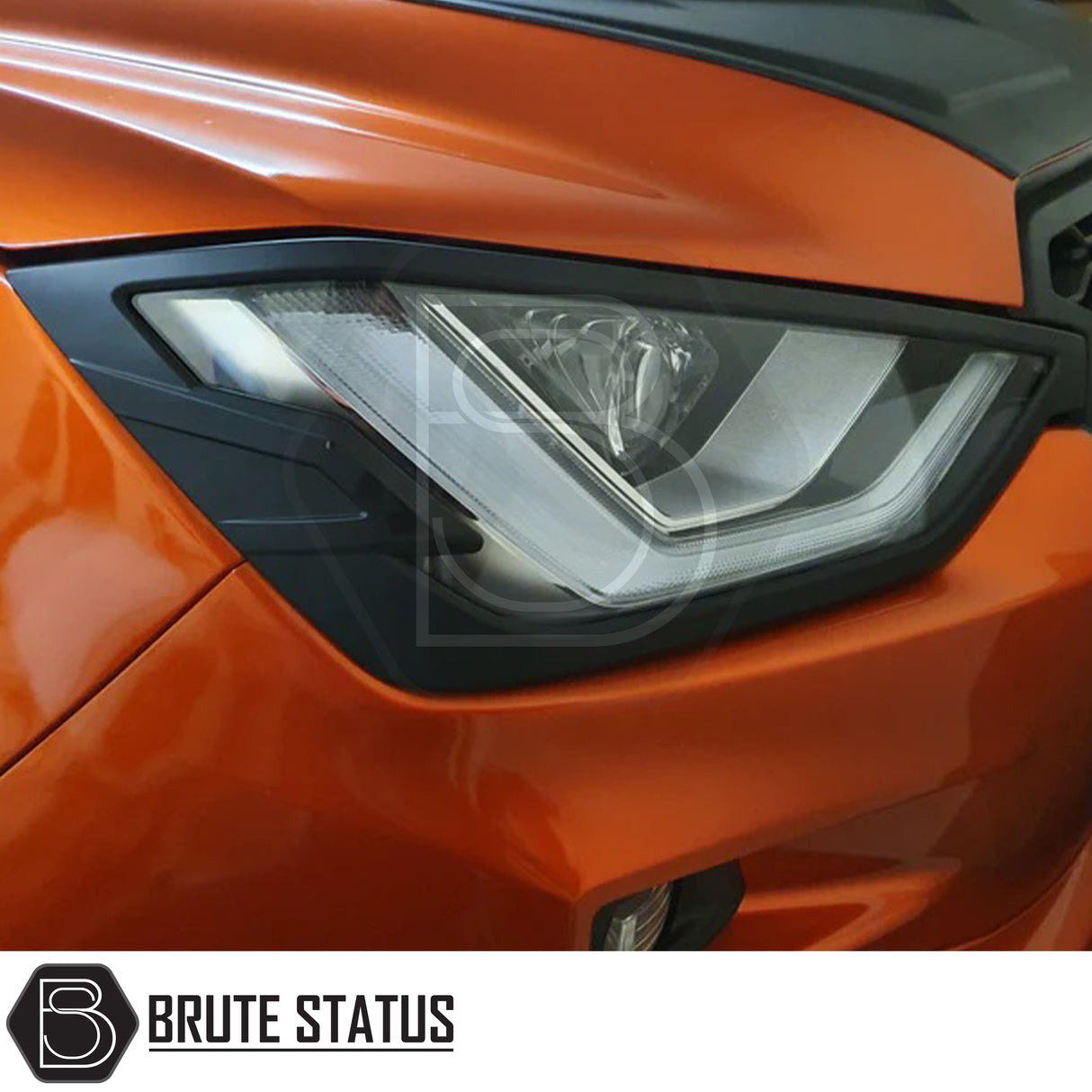 Isuzu D-Max 2021+ Headlight Covers in matt black, showcasing a sleek design for enhanced front-end aesthetics, perfect for a distinctive truck upgrade.