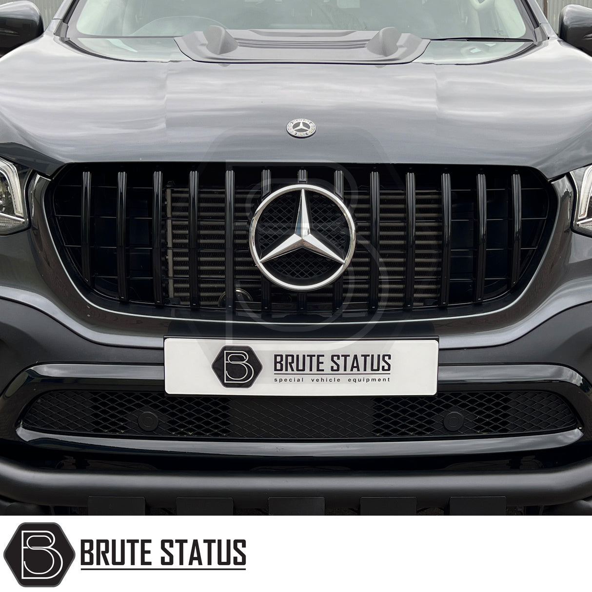Mercedes X-Class AMG Panamerica Style Front Grille (All Black) installed on a white car, showcasing its sleek design and fitment, ideal for enhancing truck aesthetics.