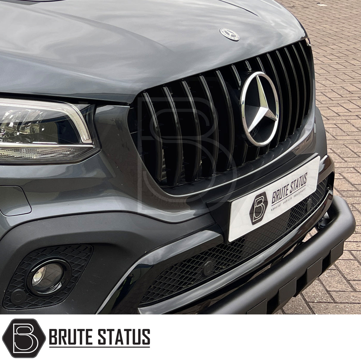 Mercedes X-Class AMG Panamerica Style Front Grille (All Black) installed on a white car, showcasing its sleek design and fitment, ideal for enhancing truck aesthetics.