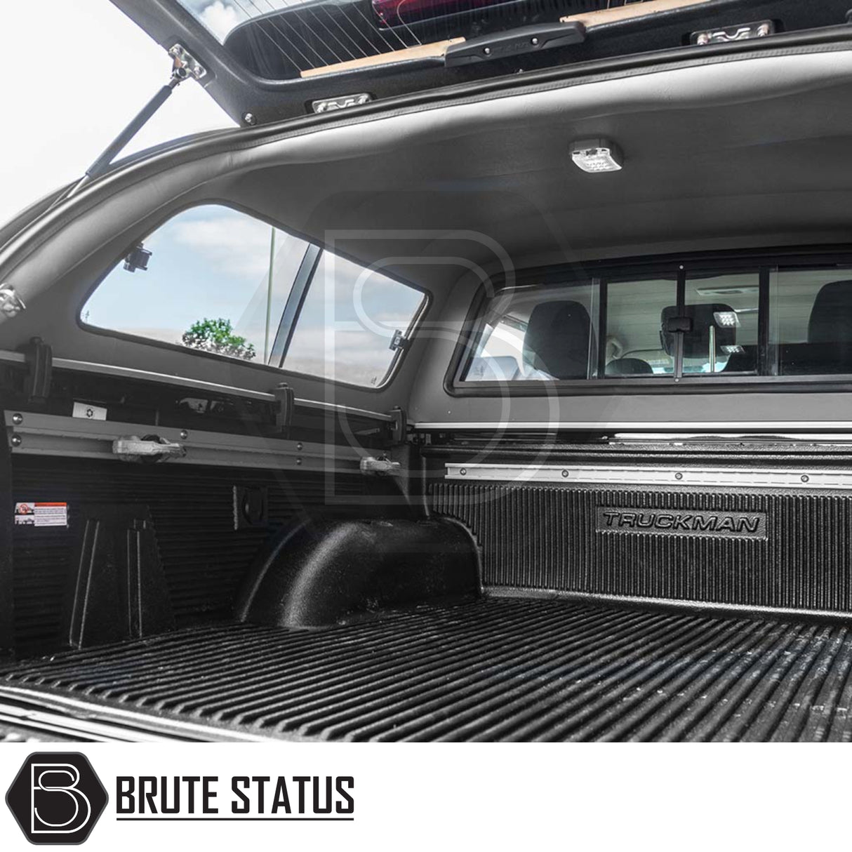 Mercedes X-Class 2017-2020 Truckman GLS Hardtop Canopy with remote locking, roof bars, sliding windows, ribbed bed liner, dome light, and branded bulkhead panel visible.