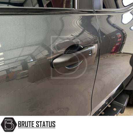 Matt black ABS plastic door handle covers for Mercedes X-Class, designed to de-chrome and enhance vehicle appearance. Easy to install with pre-applied high-quality 3M adhesive tape, requiring no specialist tools or knowledge. Fade-resistant and durable, with fitting instructions available on request. For best results, ensure clean surface and apply in warm conditions