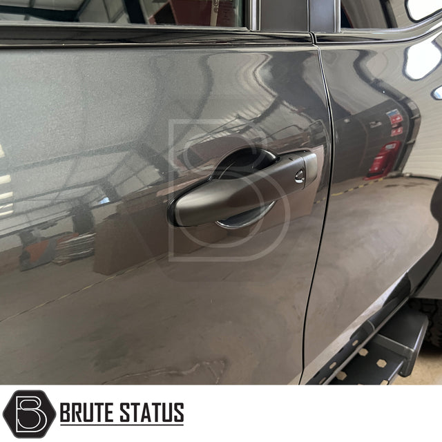 Matt black ABS plastic door handle covers for Mercedes X-Class, designed to de-chrome and enhance vehicle appearance. Easy to install with pre-applied high-quality 3M adhesive tape, requiring no specialist tools or knowledge. Fade-resistant and durable, with fitting instructions available on request. For best results, ensure clean surface and apply in warm conditions