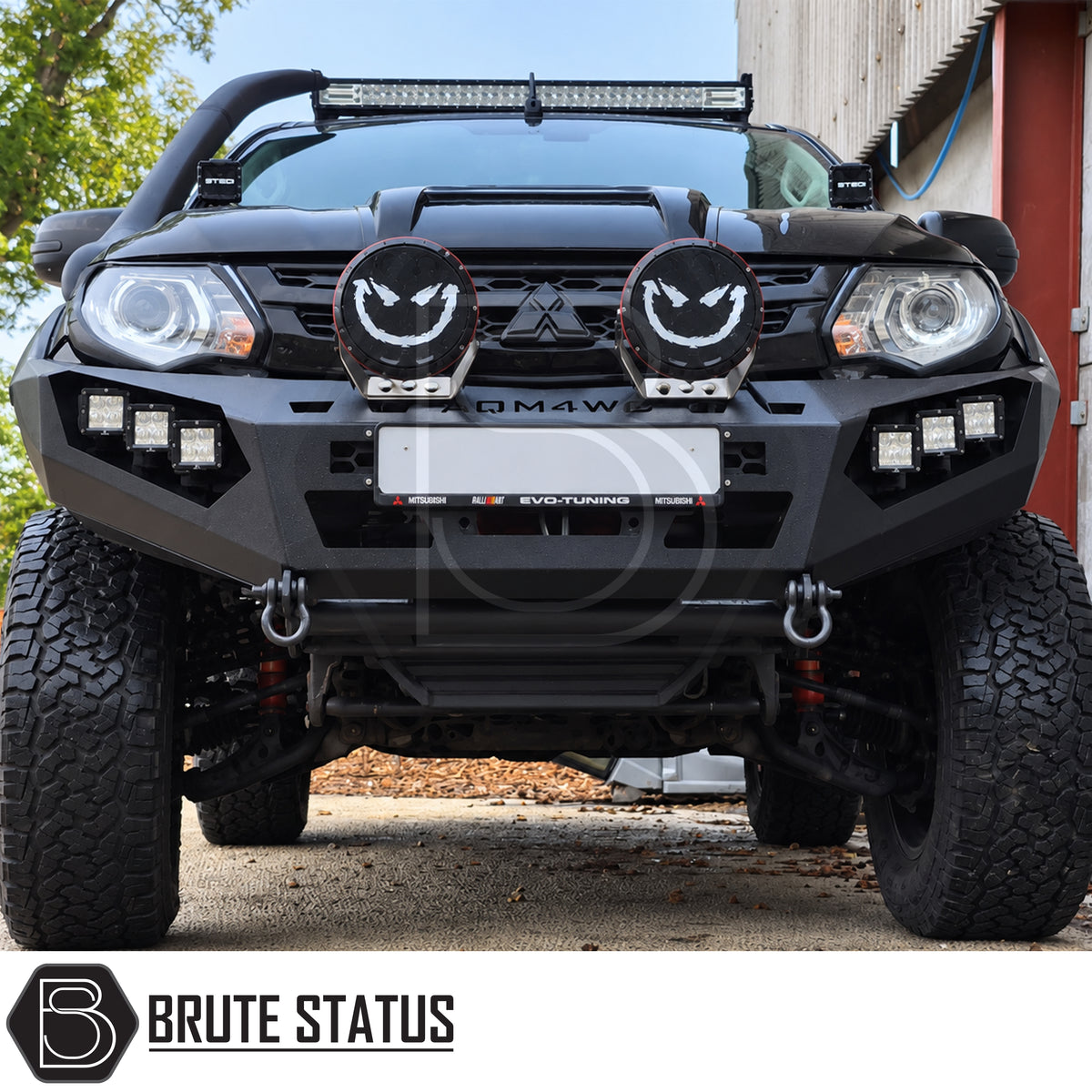 Mitsubishi L200 MK5 2015-2019 heavy duty off road winch front bumper with matte black powder coated carbon steel construction integrated LED lights and winch mounting space for front end protection.