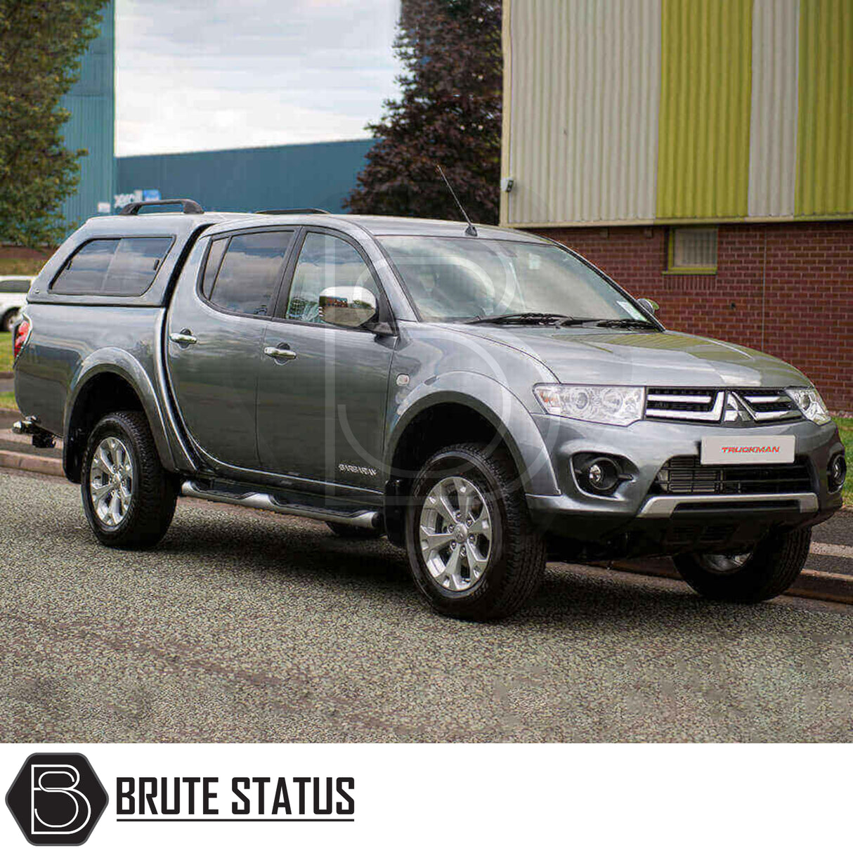 Mitsubishi L200 2010-2015 Series 4 with Truckman GLS Hardtop Canopy, showcasing a stylish, lockable design with sliding windows, parked on an industrial forecourt.