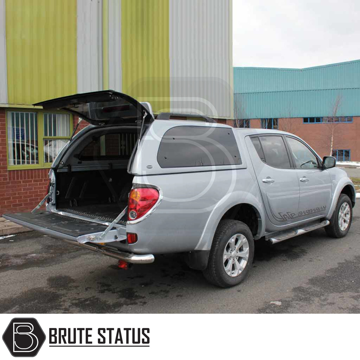 Mitsubishi L200 Series 4 Truckman Grand hardtop canopy with open hatch, showcasing the empty cargo area. Features include remote locking and tinted pop-out windows.