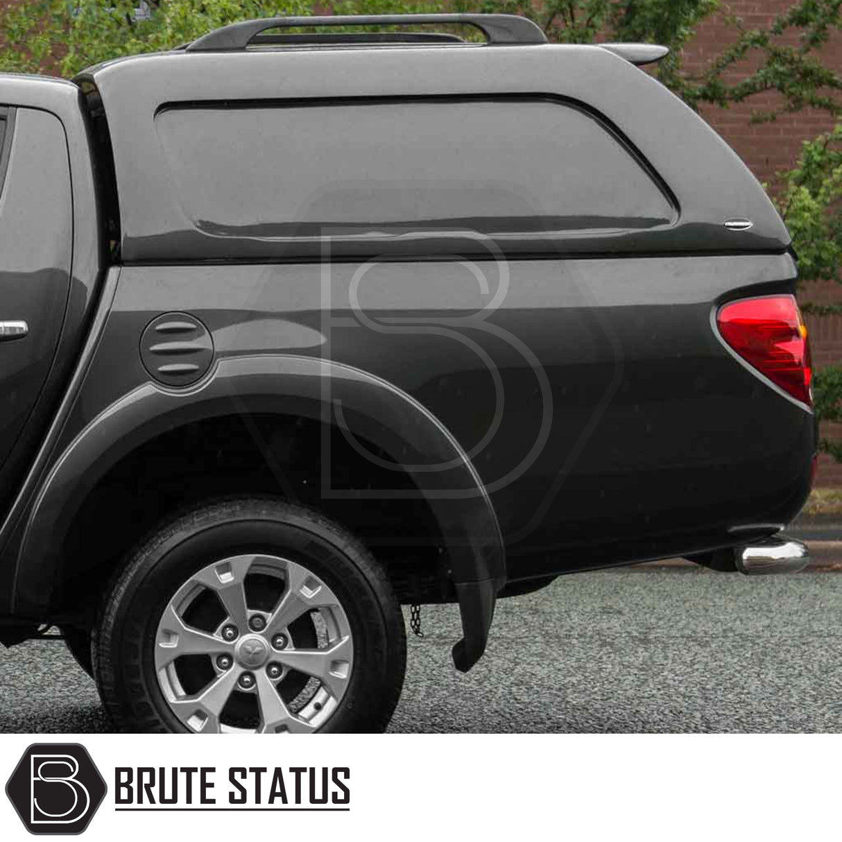 Mitsubishi L200 2010-2015 with Truckman L-Series Canopy, featuring remote locking and sleek design, enhancing storage and security. Visibly includes alloy rim and canopy roof rack.