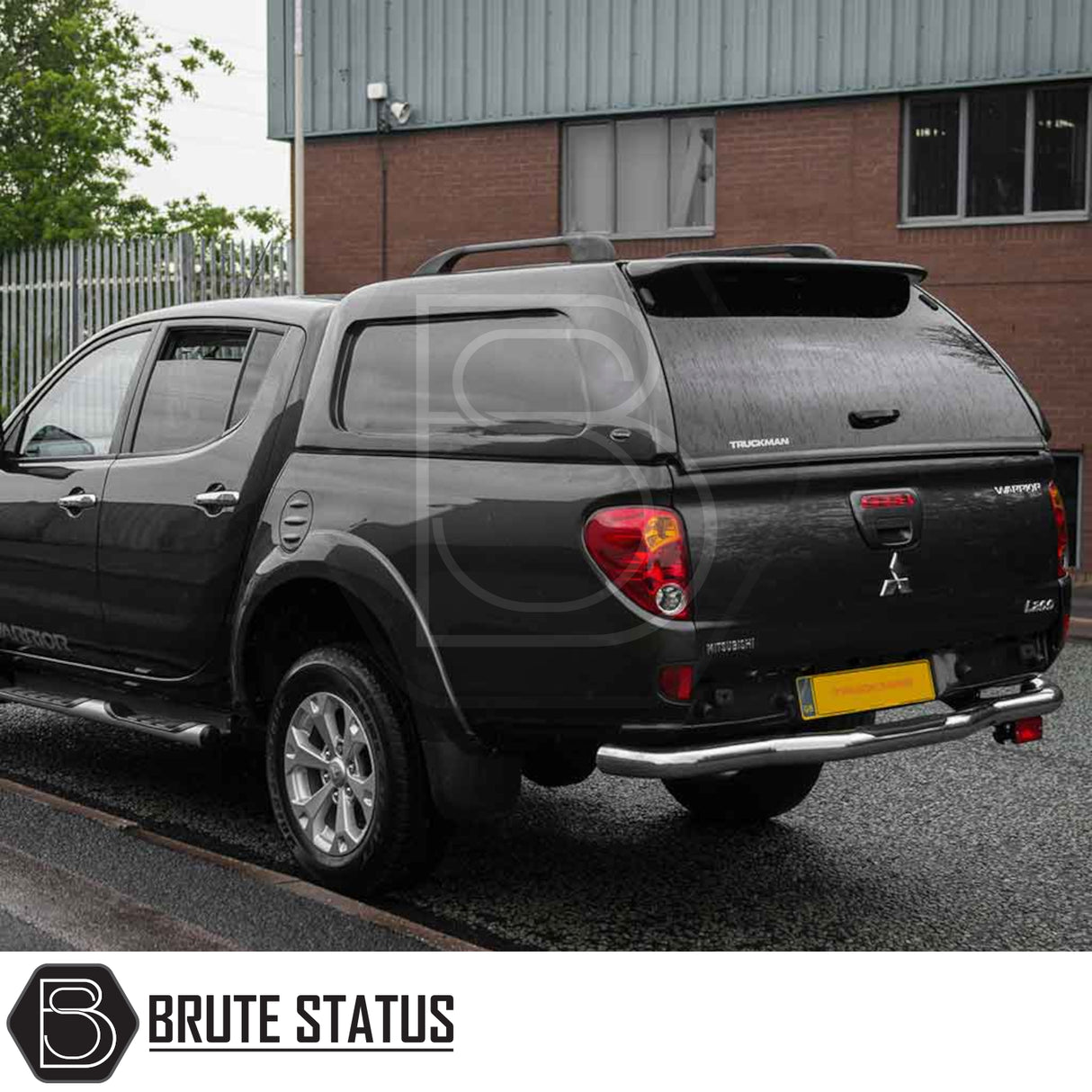Mitsubishi L200 2010-2015 Long Bed Truckman L-Series Hardtop Canopy, showcasing rear view with alloy wheels and chrome bumper, highlighting secure and stylish storage.