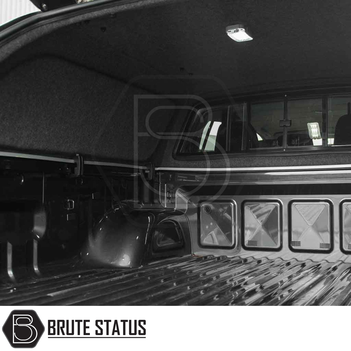 Mitsubishi L200 2010-2015 Truckman L-Series hardtop canopy, featuring carpeted liner, cargo rails, LED light, and remote locking for enhanced truck bed security and utility.