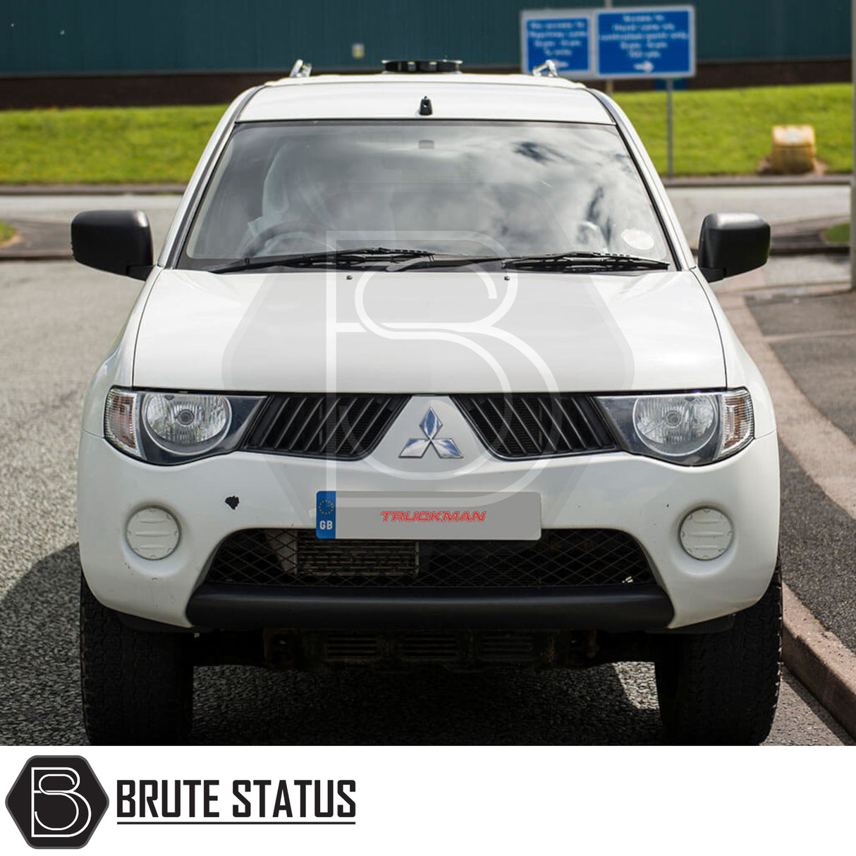 Mitsubishi L200 2010-2015 Long Bed Truckman RS Hardtop Canopy with glazed rear window, enhancing security and versatility for commercial use, parked roadside.