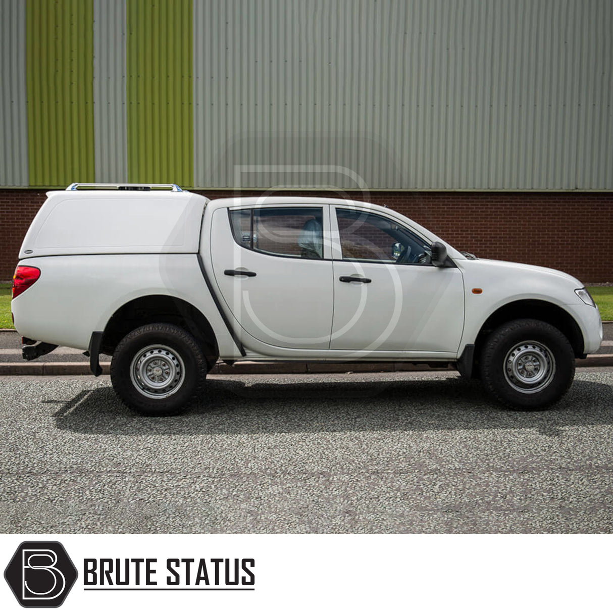 Mitsubishi L200 2010-2015 Series 4 Truckman RS Hardtop Canopy with glazed rear window, solid sides for security, shown parked beside a building.