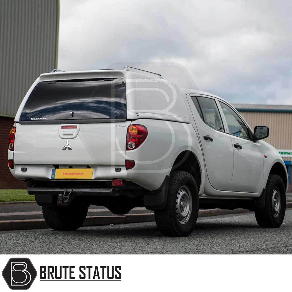 Mitsubishi L200 2010-2015 Series 4 with Truckman RS Hardtop Canopy featuring a glazed rear window, parked by a street, highlighting its secure, solid-sided design.
