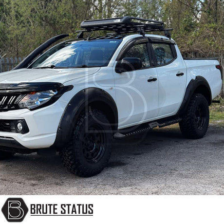 Mitsubishi L200 Series 5 2015-2019 Heavy Duty S32 Steel Side Steps in matt black, shown installed on a parked vehicle, highlighting durability and design.